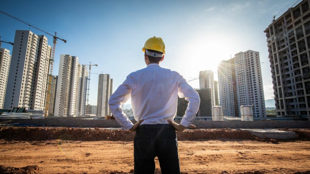An engineer looking at the buildings.
