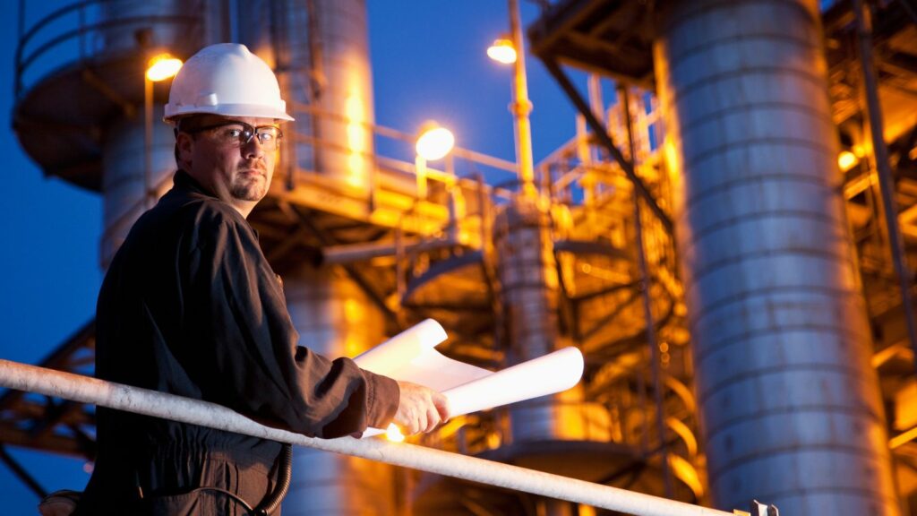 Engineer with a document plan in his hand,