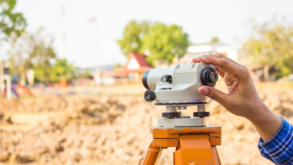 Civil engineer land survey with theodolite.